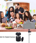 Family gathering with Universal 1/4 Inch Swivel Mini Ball Head Mount and DSLR camera on tripod, ideal for capturing events.