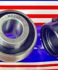 HC202 axle bearing insert with eccentric collar for 15mm shafts, featuring precise alignment and secure mounting for machinery applications.