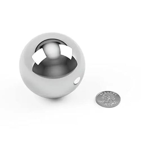 Get Top Shelf Performance With These Bad Ass High Precision G Twenty Five Grade Chrome Steel Ball Bearings Measuring One Point Five Inch In Diameter Hot Forged For Ultimate Durability And Reliability Perfect For Heavy Duty Applications next to a quarter for size comparison.