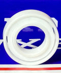 Front view of 7902 Angular Contact Full Ceramic Bearing 15x28x7mm, showcasing its zirconium oxide construction against a blue background.