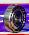 Close-up of 20-Pack 625ZZ Bearings 5x16x5mm Metal Shielded 5mm Bore Miniature Bearing on colorful backdrop.