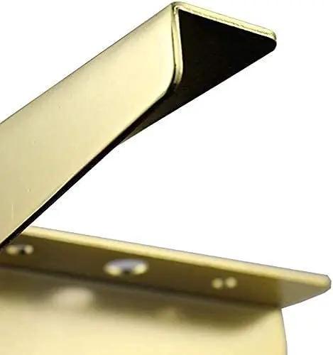 Close-up of Built Tough Gold Trimmed Tripod Furniture Legs With Thick Triangle Base For Coffee Tables Sofas And TV Stands.