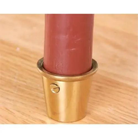 Premium Solid Brass Round Caster Cups For Furniture Legs, 1 3/16" wide, protecting wooden leg with rustic charm.