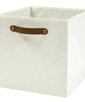 A Straight Up Game Changer Collapsible Fabric Cube Storage Bin Vanilla Canvas Organizer Tote with cut out handle.