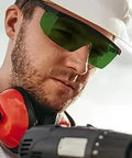 Close-up of a man wearing Professional Kick Ass Laser Safety Glasses With OD4 Plus Shield for welding and IPL protection.