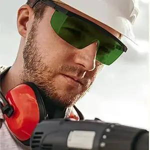 Close-up of a man wearing Professional Kick Ass Laser Safety Glasses With OD4 Plus Shield for welding and IPL protection.