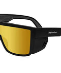 Rock Solid Gold Mirror Safety Glasses With Sleek Matte Black Frame And Removable Side Shields For Serious Eye Protection Powered By Ansi Z87 Certification Featuring Plush Foam Cushioning Built Tough For The Daily Grind side view with gold lenses.