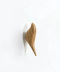 Straight Up Best Bird Shaped Resin Wall Hook With Wood Grain Finish For Coats And Hats Slick Wall Mounted Bedroom Organizer Smooth Edge Design Sweet Home Decor Plus Hassle Free Install mounted on a white wall.