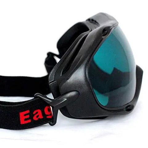 Heavy Duty Laser Safety Goggles Featuring Wide Spectrum Od4 Polycarbonate Lenses That Block Harmful Uv And Infrared Rays For Lab Tasks And Workshop Projects Providing Rock Solid Eye Protection With A Comfy Fit For Serious Shop Use No Cap side view of black laser safety goggles with tinted lenses and adjustable strap