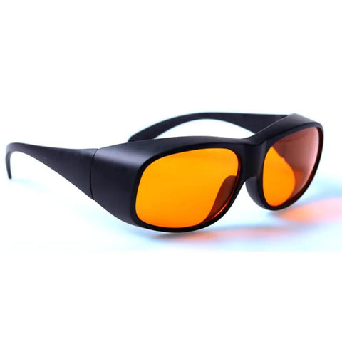 Badass Laser Safety Goggles For Blue And Green Beams Rock Solid Optics With Optical Density Five Shielding For Workshop Tasks And Precision Cutting Kick Butt Eye Armor With Crisp Vision And Grit Tough Comfort All Day Long, featuring orange tinted lenses.