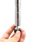 Close-up of a hand adjusting a silver 3/8 inch threaded leveling foot bolt for furniture with a nylon base