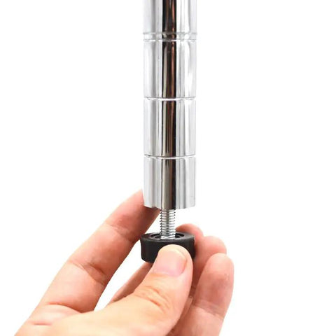 Close-up of a hand adjusting a silver 3/8 inch threaded leveling foot bolt for furniture with a nylon base