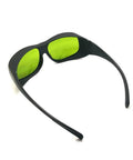 Real Deal Eye Protection With Heavy Duty Infrared Laser Glasses For Dental Diode Tools Featuring OD 1 At 660 Nm And OD 5 Up To 1095 Nm With Clear Coated Lenses, black frame with green lenses, angled view.