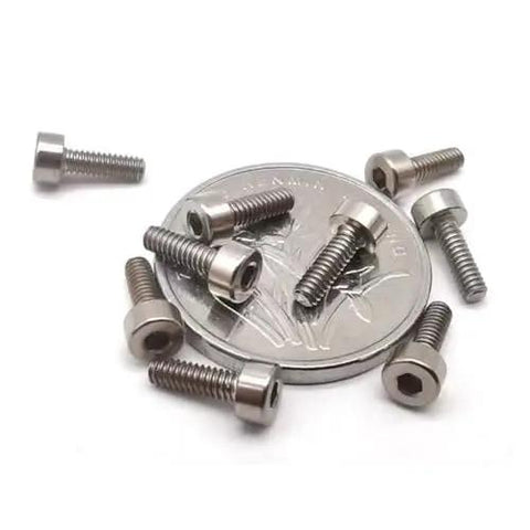 Shop Floor Ready TC4 Titanium Cup Head Hex Socket Screw M20 Metric Specification on top of a coin for size comparison.