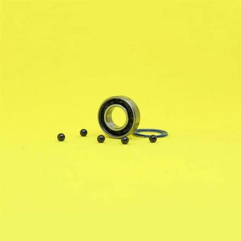 Heavy Duty Hybrid Ceramic Bearings 8x16x5mm Abec-1 with Si3N4 balls and steel races on yellow background.