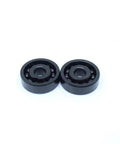 Industrial Grade TB6302 High Temperature Full Ball Bearing Built Tough For Extreme Engines Handling Serious Heat Up To Five Hundred Degrees Celsius With A Rock Solid 15X42X13 mm Profile And Smooth Rotation, two black bearings.