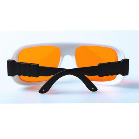 Top Shelf Teal Laser Safety Glasses With OD 5 Plus Shielding Two Hundred Through Five Hundred Forty Nanometers, featuring orange lenses.