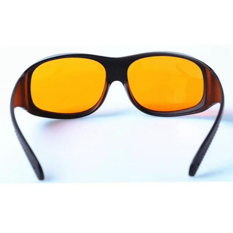 Heavy Hitter Laser Safety Glasses With OD5 Filter Blocking Violet Blue Green Lasers Built Different Construction viewed from the rear with orange lenses.