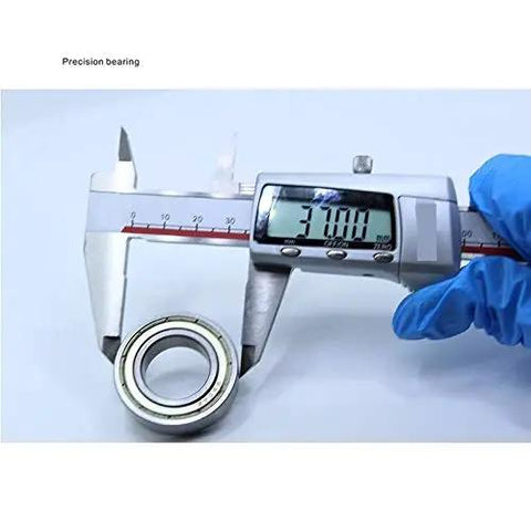 Built Tight And Smooth Rolling Rock Solid 6904zz Thin Section Ball Bearing Kit Abec One Precision Deep Groove Roller being measured with calipers.