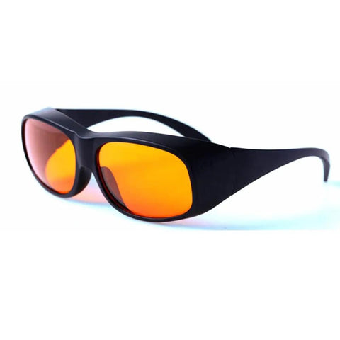 Badass Laser Safety Goggles For Blue And Green Beams Rock Solid Optics With Optical Density Five Shielding For Workshop Tasks and Precision Cutting. Black frame with orange tinted lenses.