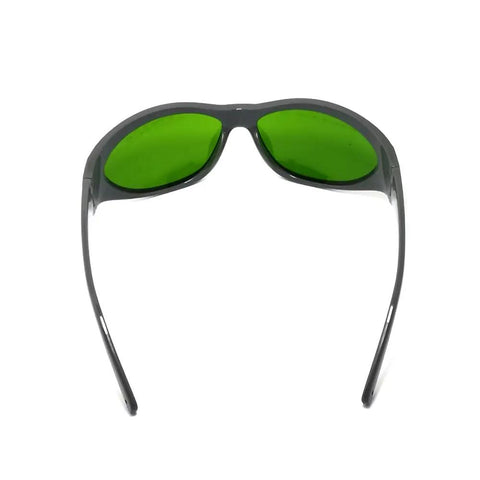 Heavy Duty Infrared Laser Safety Eyewear Providing Sweet Optical Density Ratings And Broad Waveband Coverage From Seven Forty To Eleven Hundred Nanometers with green lenses and wraparound design.