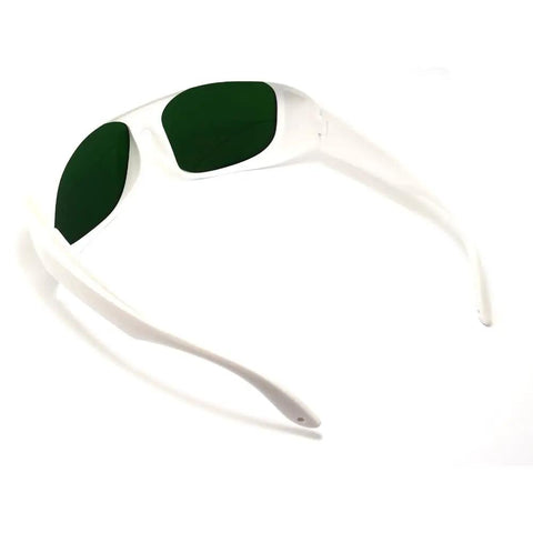 Top Shelf Infrared Laser Safety Glasses Built Different For Total Nd Yag Defense Across 720 To 1100Nm Ranges With Crisp Clear Optics And Rock Solid Od7 Plus Lens Shield, white frame and green lens.