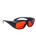 Slick Laser Safety Goggles Featuring Badass OD7 Plus Optics Covering Deep Ultraviolet And Green Beams Across Critical Wavelengths For Precision Lab Safety Gear in black frame with red lenses.