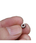 Close-up of 0.3 Module Planetary Gearbox With 18 Teeth 5.95 Millimeter Diameter And 2.55 Millimeter Bore, held between fingers