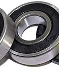Pro Grade Front Load Washing Machine Bearing And Seal Kit Featuring Rock Solid Dual Ball Bearings And A Thick Rubber Gasket, showcasing two metal ball bearings and a rubber seal.