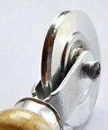 Close-up of a double head pressure wheel on the Badass Window Roller With Wooden Handle For Screen Window Seals and Rubber Strips.