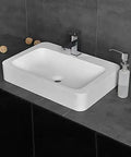 Slick Rectangular Bathroom Vessel Sink Crafted From Heavy Duty Artificial Stone Table Top Basins Featuring Thick Edges That Hold Up Over Years Durable White Countertop Washbasin on dark vanity