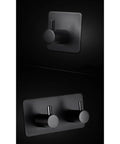 Rock Solid Black Stainless Steel Adhesive Wall Hook For Coats Towels And Umbrellas With No Hassle Peel Stick Mount close-up view