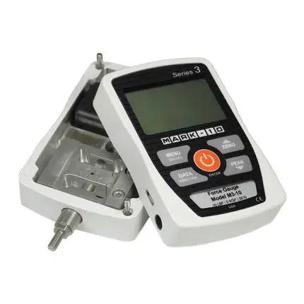Slick Digital Force Gauge Delivering 50 Pound Capacity And Straightforward Usb Hookup For Tension Or Compression Tasks Featuring Two Thousand Hertz Sampling Speed And Hella Reliable Point Three Percent Accuracy In An Ultra Compact Build showing the open unit with LCD screen and probes.