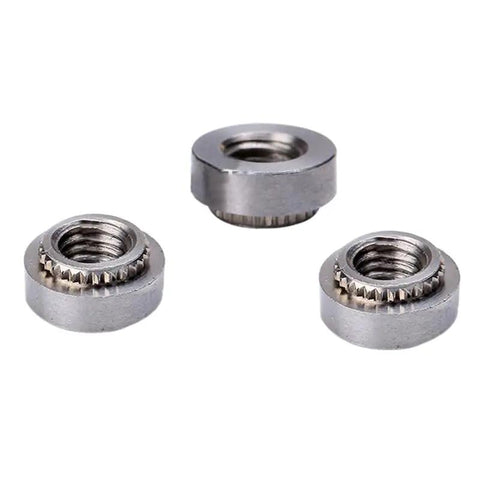 Top Notch M3 Stainless Steel Self Clinching Rivet Nut Fasteners Twenty Five Piece Heavy Duty Hardware Pack, close view of three nuts.