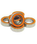 Pro Level Abec 7 Hybrid Ceramic Bearing With Rust Resistant 440C Steel Rings And Twin Rubber Shields 10x15x4 mm stacked together.