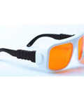 Top Shelf Teal Laser Safety Glasses With OD 5 Plus Shielding Two Hundred Through Five Hundred Forty Nanometers with orange lenses.
