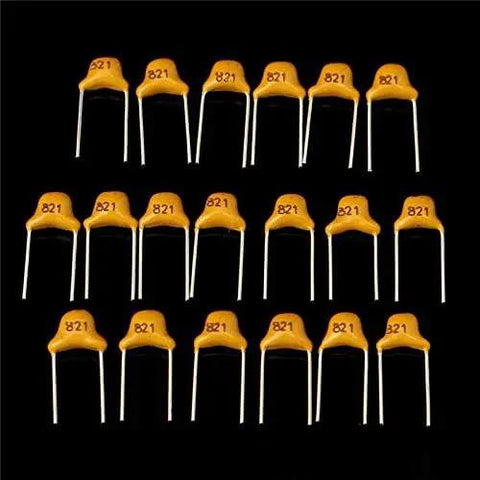 Badass 360 Piece Multilayer Ceramic Capacitors Assortment Kit 18 Values Heavy Duty NPO COG Caps 5Pf To 820Pf, yellow capacitors with markings.