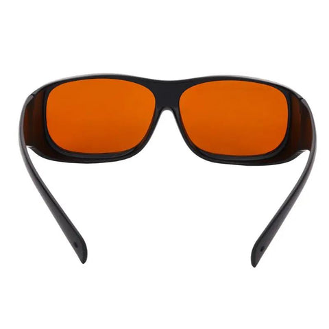 Professional Grade Kickass Laser Safety Glasses With Hella Od5 Plus Eye Defense Across One Hundred Ninety To Eleven Hundred Nanometer Wavelength Range For Spa Studios And Beauty Clinics In Classic Orange Lens, front view.