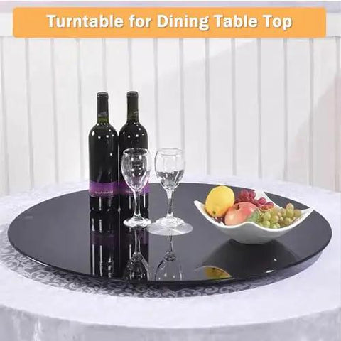39 Inch Glass Lazy Susan Turntable With Six Super Slick Wheels Hella Sturdy Rotating Serving Tray on dining table with wine and fruit.