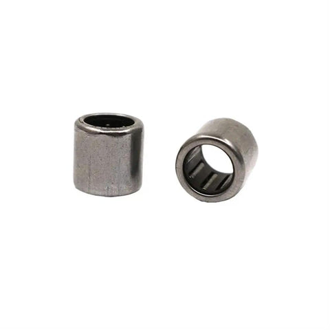 Heavy Duty One Way Needle Roller Bearing Pack For Engine Clutch Shafts Thick Chrome Steel Build Crafted To Handle Massive Axial Loads With Lock Tight Fit And Effortless Rotation Daily - two chrome steel needle bearings visible