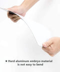 Emergency Eyewash Station Access Clearing Warning Sign Aluminum Plate 8 By 12 Inch shown being bent by hand for durability display.