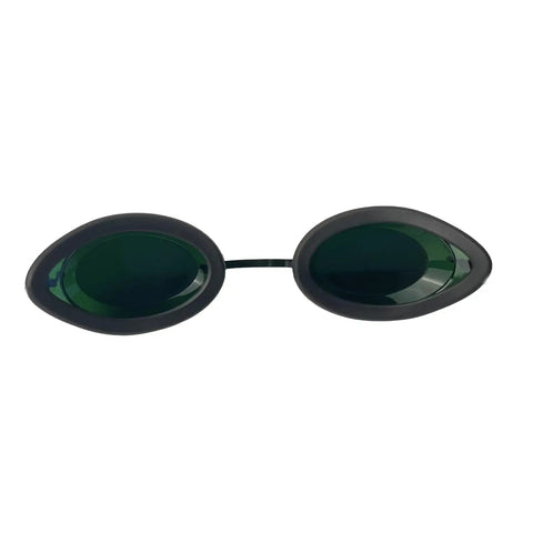 Top Shelf Laser Safety Glasses For IPL And Red Light Therapy Featuring Solid Polycarbonate Lenses That Deliver Broad 200 To 2000nm Eye Protection No Sweat Guaranteed, with green tinted lenses.