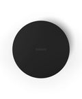 Top view of Sub Mini Compact Wireless Subwoofer For Beam And Ray, sleek black finish, circular design, flat surface.