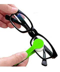 Green mini eyeglasses cleaning tool with microfiber pad cleaning black rectangular glasses