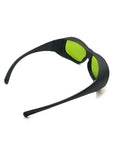 Real Deal Eye Protection With Heavy Duty Infrared Laser Glasses For Dental Diode Tools Featuring OD 1 At 660 Nm And OD 5 Up To 1095 Nm With Clear Coated Lenses, side view of black frame with green lenses.