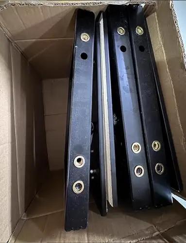 Heavy Duty Hidden Access Panel With Concealed Door Hinge Kit For Tile And Stone, black metal parts in a cardboard box.