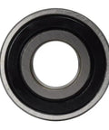 Close-up view of 203JD Agricultural Spindle Bearing 2 Pack.669 Round Bore, showcasing smooth black seal and precision construction.