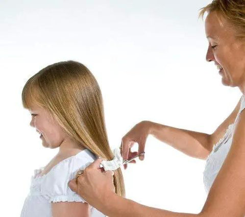 Effortless Home Hair Cutting Guide Designed For Lowkey Perfect Bangs And Seamless Salon Quality Diy Trimming Tool Set Of Two For All Hair Types Zero Hassle Quick Fix, woman cuts girl's long hair.
