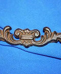 Straight Up Classic Victorian Swirl Cast Iron Drawer Pulls Set Of 20 For Furniture And Cabinet Restoration 6 1/4 Inch Brown Door Handle with swirl design on blue background.