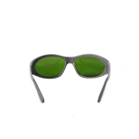 Heavy Duty Pro Grade Laser Protective Glasses Featuring Crisp Vision Lines For Super Broad Spectrum Coverage Between 200 To 1400 Nanometer And Smooth Operation During Professional Beauty Treatments That Deliver Game Changing Eye Shielding Without Any, with green tinted lenses.